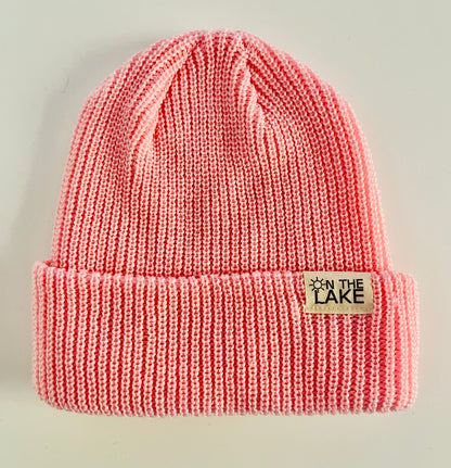 Pink winter toque with On The Lake logo. Can be worn folded or slouchy. One size fits most. 